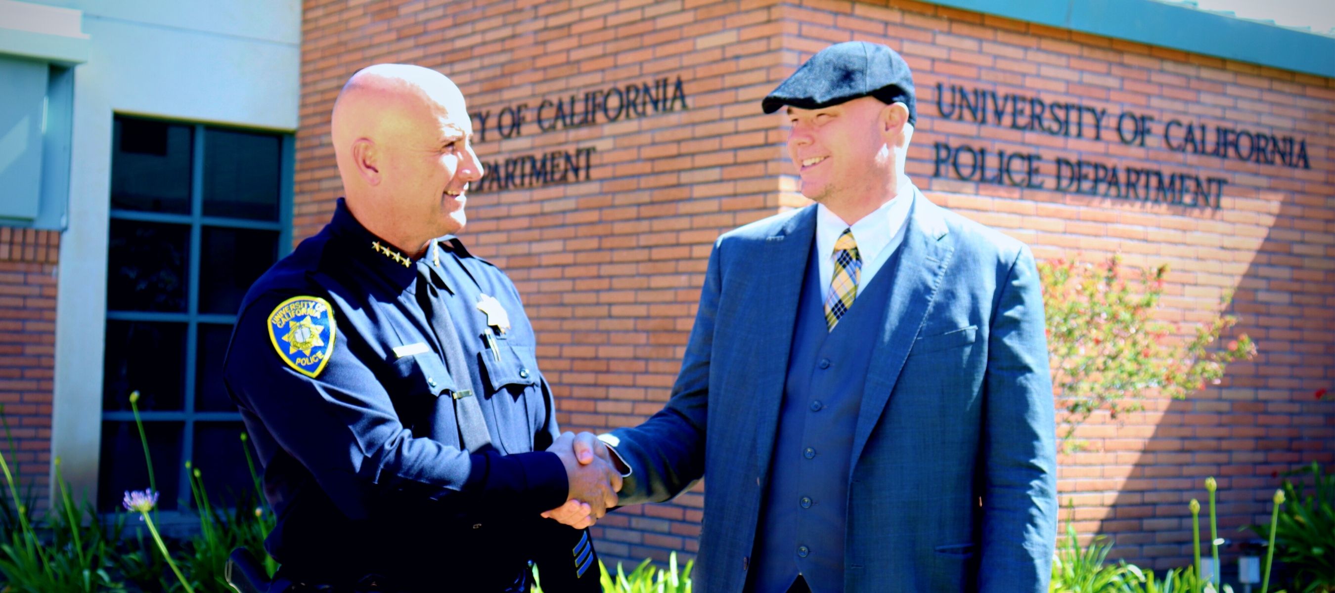 police chief shakes hands with chief information security officer