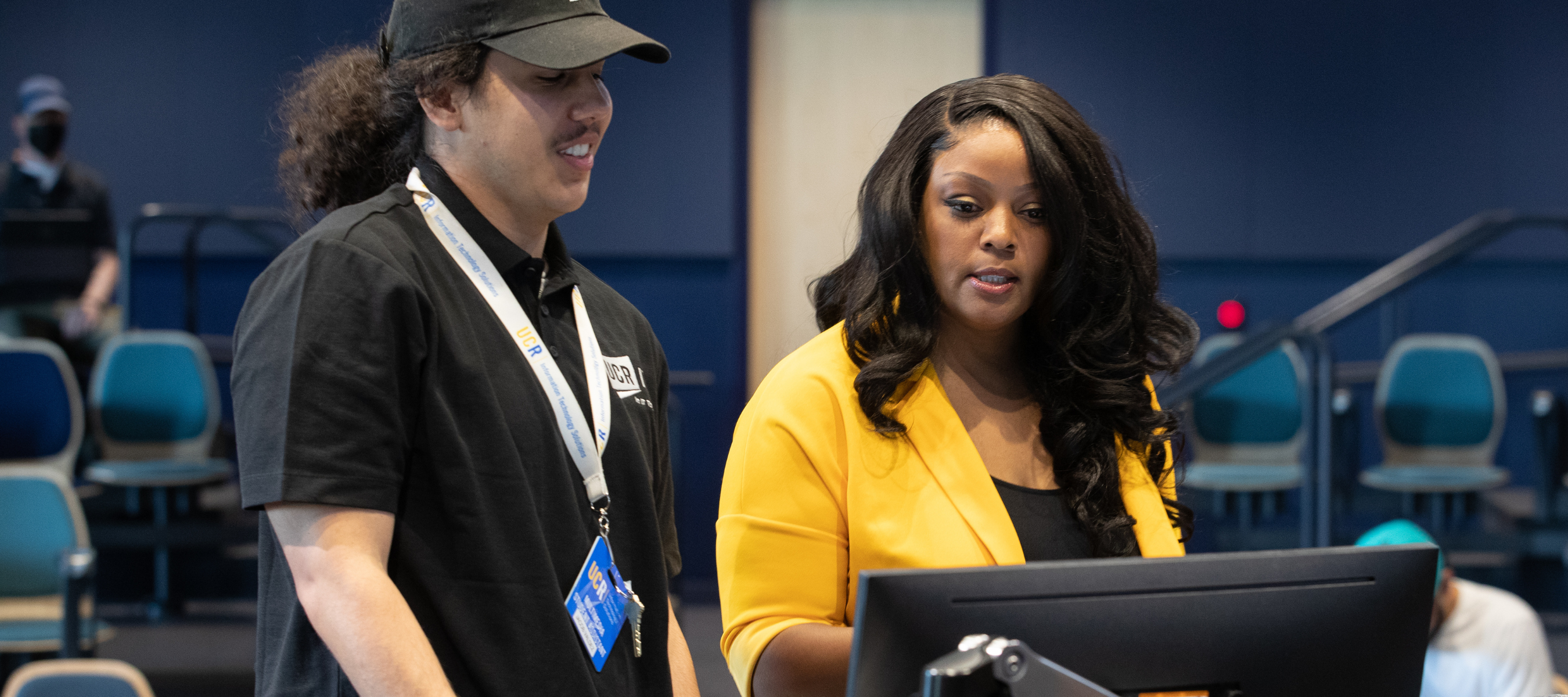 ITS Staff member helping a faculty member