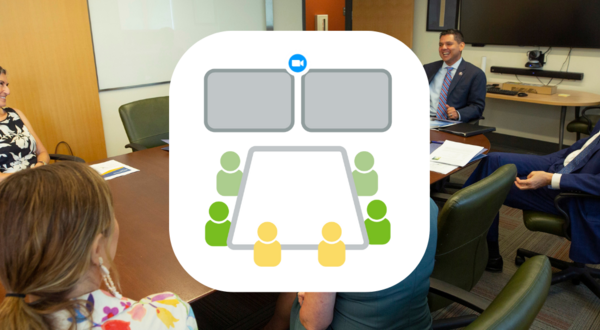 group of people sitting in a conference room