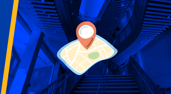 An animated navigation icon and map over the staircase at the student success center