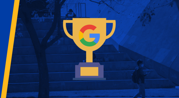 A trophy with a google logo with UCR bell tower in background