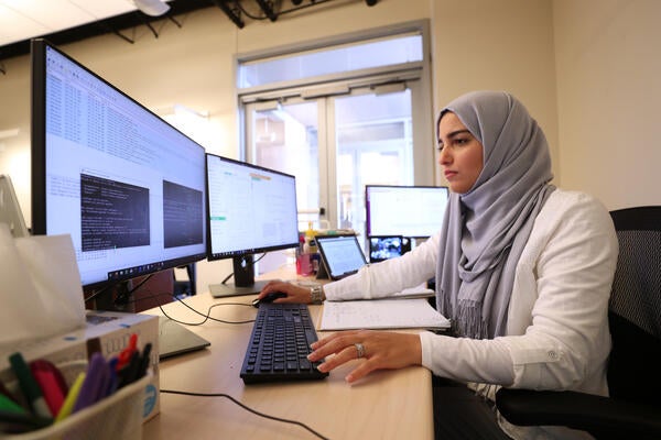 A staff member working on her computer