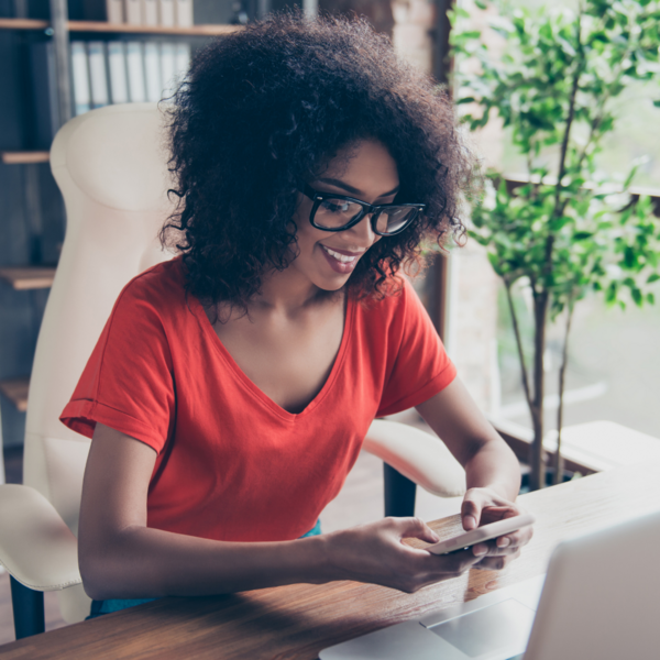 woman on phone checking email