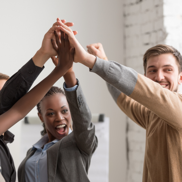 group of colleagues in a group high five