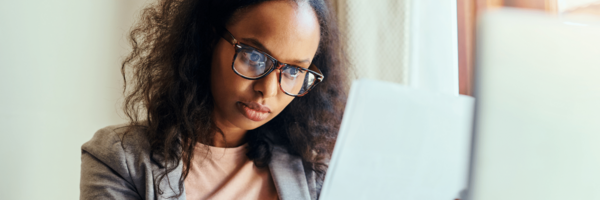 women gazes over computer