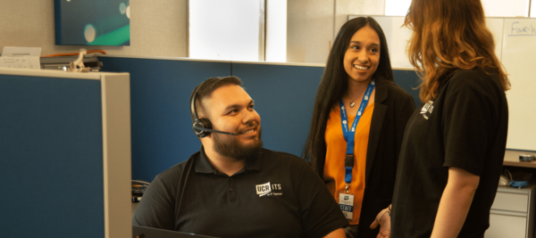 smiling staff members discuss project