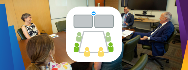 group of people sitting in a conference room