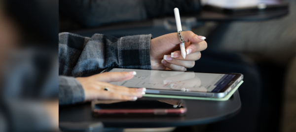 close-up of a hand using a tablet