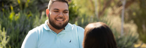 technician smiles at student during consultation