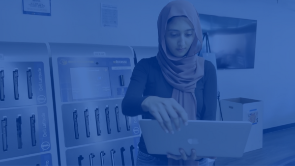 student opens laptop from kiosk