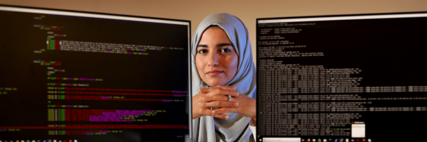 woman between two computers