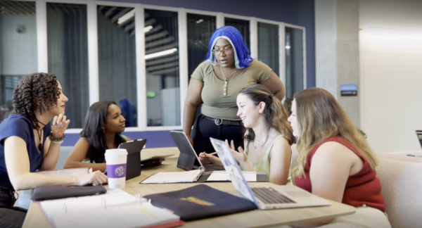 students review computer screens