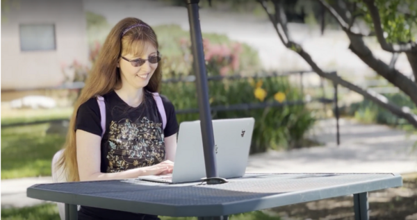 Michelle on computer outside