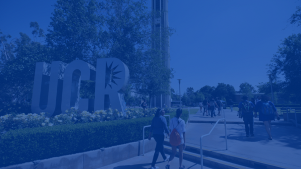 Students walking by the UCR letters