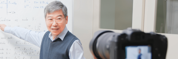 man teaching on camera