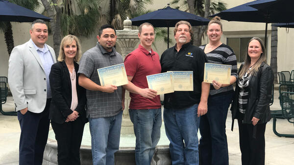 Pictured left to right: Cesar Higueros, Sheri Morgan, Michael Mendoza, David Mackay, Tim Paul, Julie Slusser, Danna Gianforte.