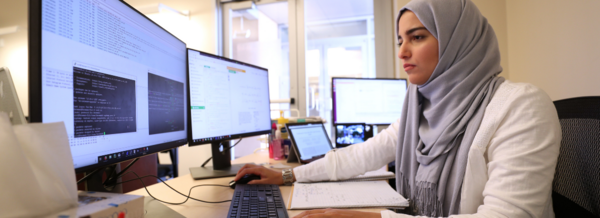 A staff member working on her computer