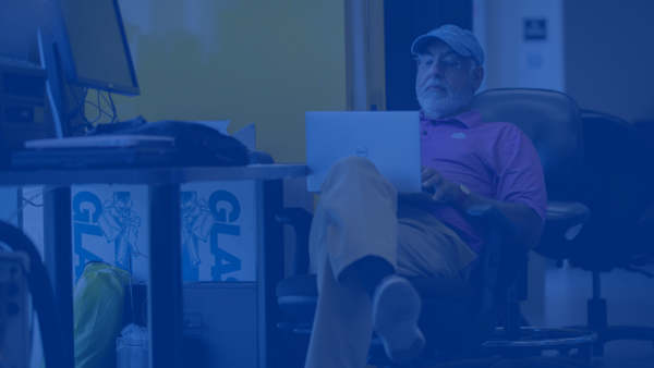 Man sitting with Laptop on lap